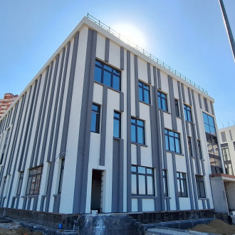Устройство СФТК с декоративной штукатуркой "Короед" и утеплением минераловатными плитами школы в Туле